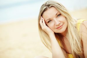 Middle aged woman resting at beach